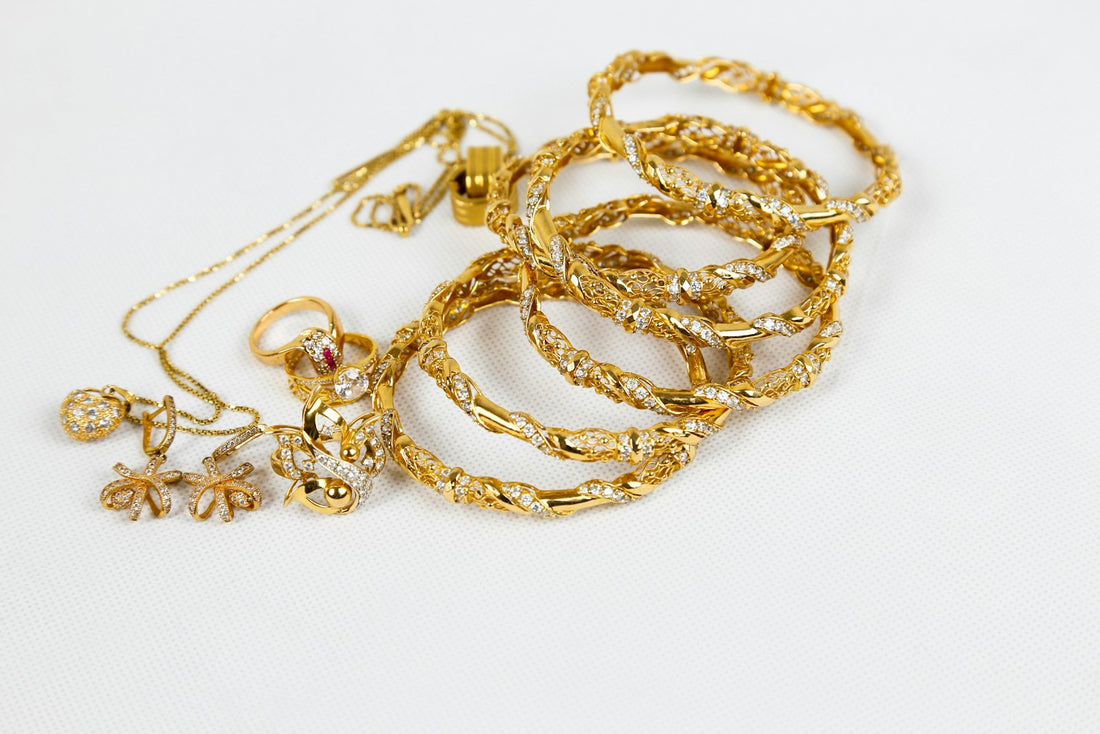 Gold-filled necklace chain resting on a light neutral surface