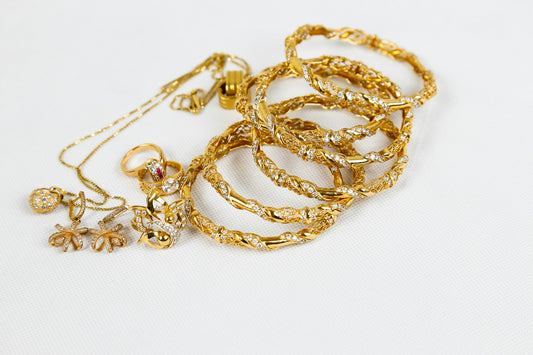 Gold-filled necklace chain resting on a light neutral surface